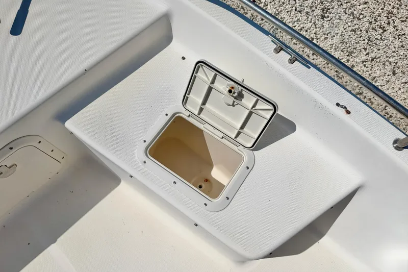 Slide: The Image of Open storage compartment on 2001 Sea Fox 215 Bay Fisher boat deck. - 25