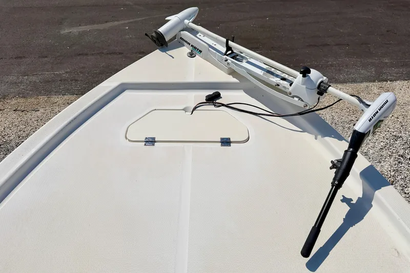 Slide: The Image of Bow of 2001 Sea Fox 215 Bay Fisher with trolling motor, on a textured surface. - 27