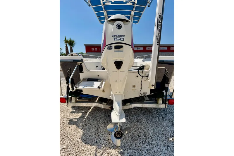 Slide: The Image of Rear view of a 2001 Sea Fox 215 Bay Fisher with Evinrude 150 outboard motor. - 30