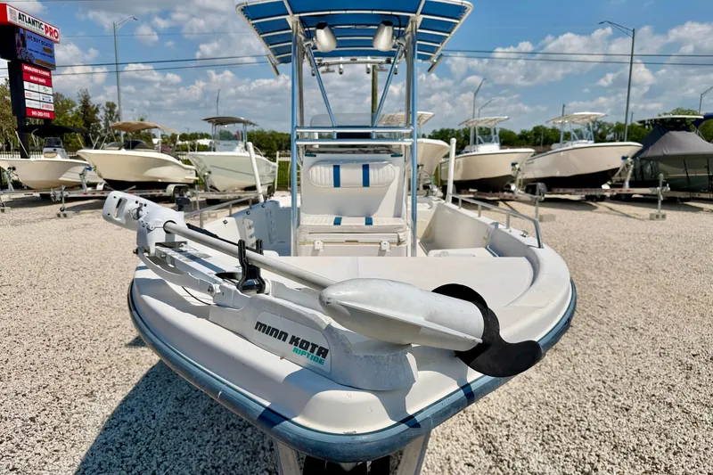 Slide: The Image of 2001 Sea Fox 215 Bay Fisher boat with Minn Kota trolling motor in a dealership lot. - 8