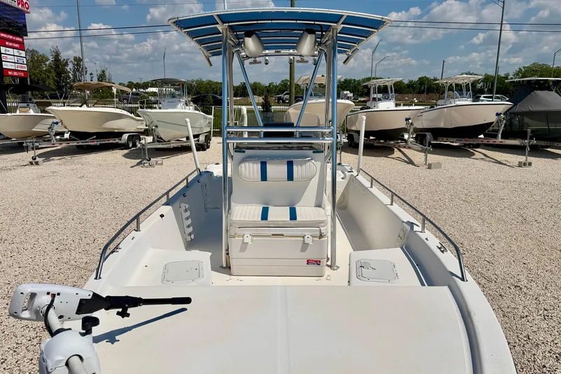 Slide: The Image of 2001 Sea Fox 215 Bay Fisher boat displayed in a sunny outdoor showroom. - 9