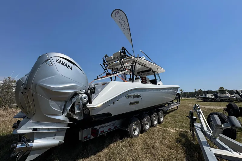 Slide: The Image of 2019 Everglades 435 Center Console boat with Yamaha engines on a trailer. - 13