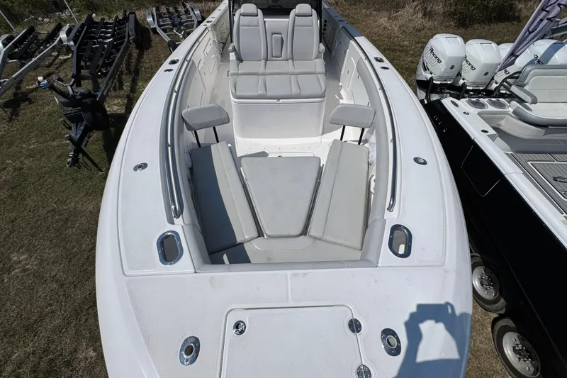 Slide: The Image of 2019 Everglades 435 Center Console boat with spacious seating and sleek design. - 14