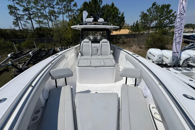 Slide: The Image of 2019 Everglades 435 Center Console boat with spacious seating and modern design. - 16