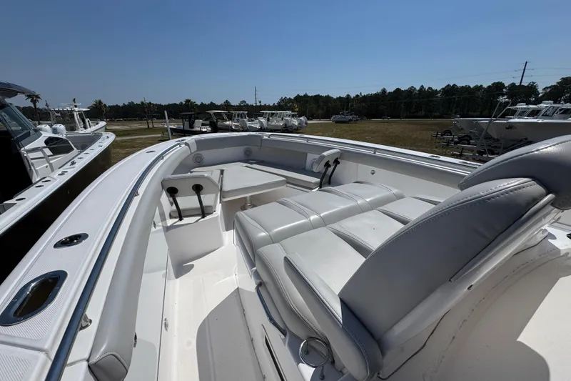 Slide: The Image of 2019 Everglades 435 Center Console boat with spacious seating and sleek design. - 17
