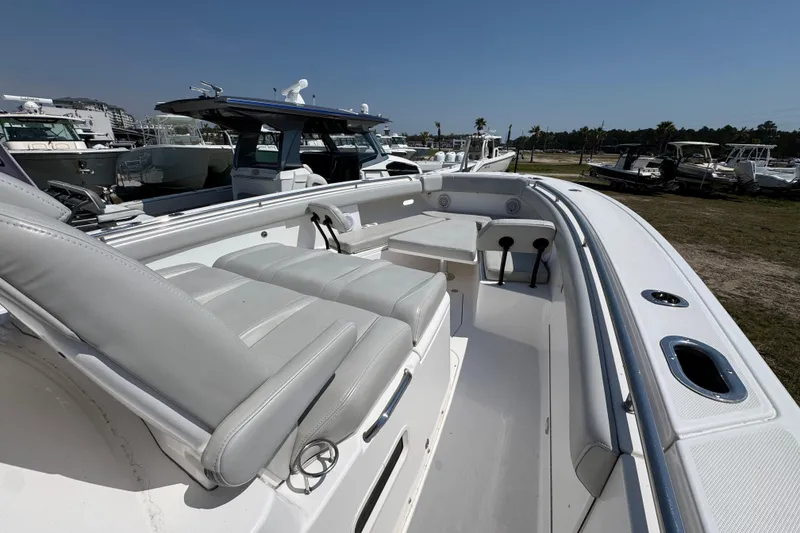 Slide: The Image of 2019 Everglades 435 Center Console boat with spacious seating and sleek design. - 19