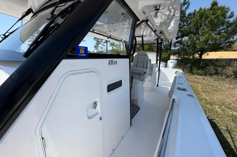 Slide: The Image of 2019 Everglades 435 Center Console boat with sleek design and spacious deck. - 20