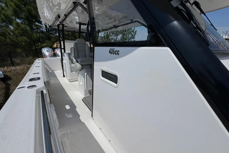 Slide: The Image of 2019 Everglades 435 Center Console boat, showcasing sleek design and spacious seating area. - 21