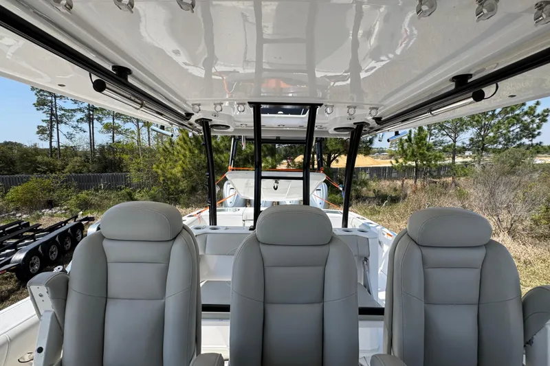Slide: The Image of Interior view of 2019 Everglades 435 Center Console boat with plush seating and sleek design. - 28