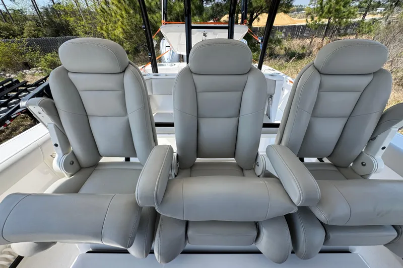 Slide: The Image of Three luxurious seats on a 2019 Everglades 435 Center Console boat. - 29