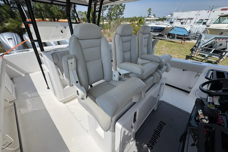 Slide: The Image of 2019 Everglades 435 Center Console boat interior with luxurious seating and modern design. - 30
