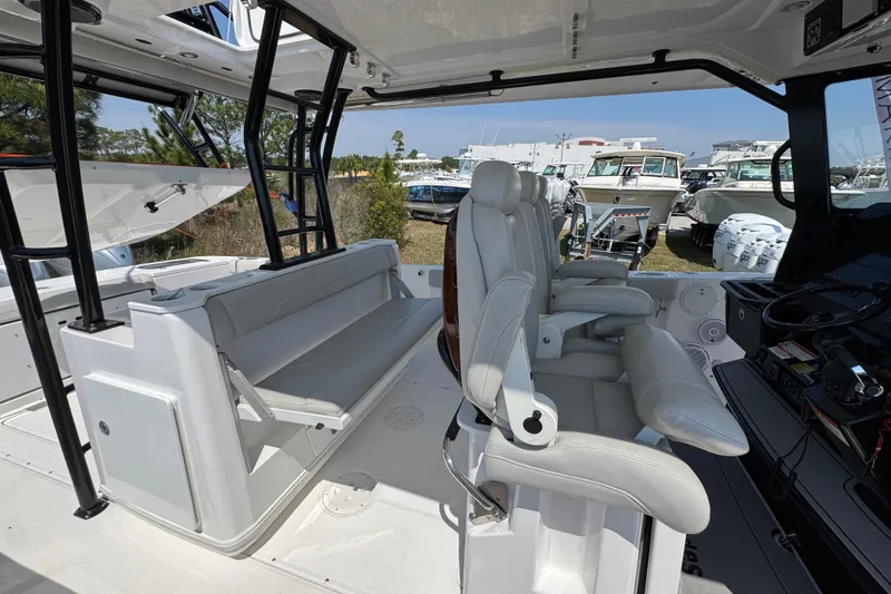 Slide: The Image of Interior of 2019 Everglades 435 Center Console boat with luxurious seating and helm station. - 31