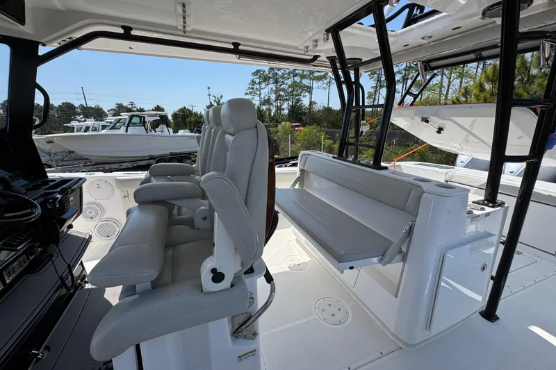 Slide: The Image of Interior view of 2019 Everglades 435 Center Console boat with seating and helm. - 32