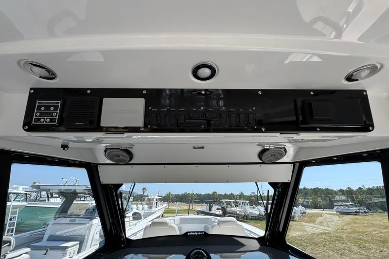 Slide: The Image of Interior view of 2019 Everglades 435 Center Console boat dashboard with control panel. - 36