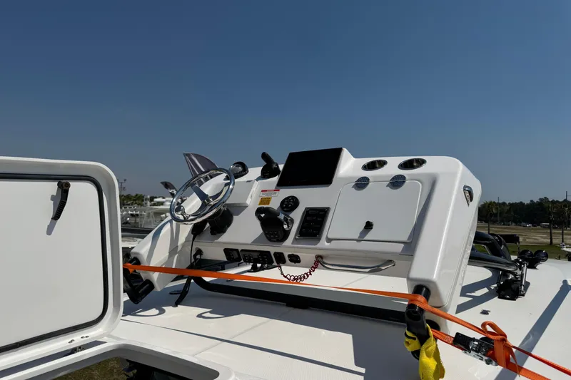 Slide: The Image of 2019 Everglades 435 Center Console boat dashboard with steering wheel and controls. - 41