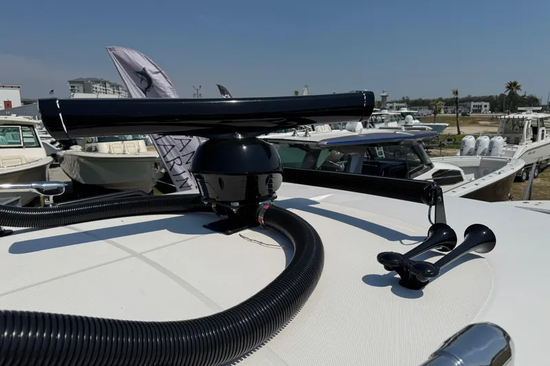Slide: The Image of Radar equipment on 2019 Everglades 435 Center Console boat, docked with other vessels. - 42
