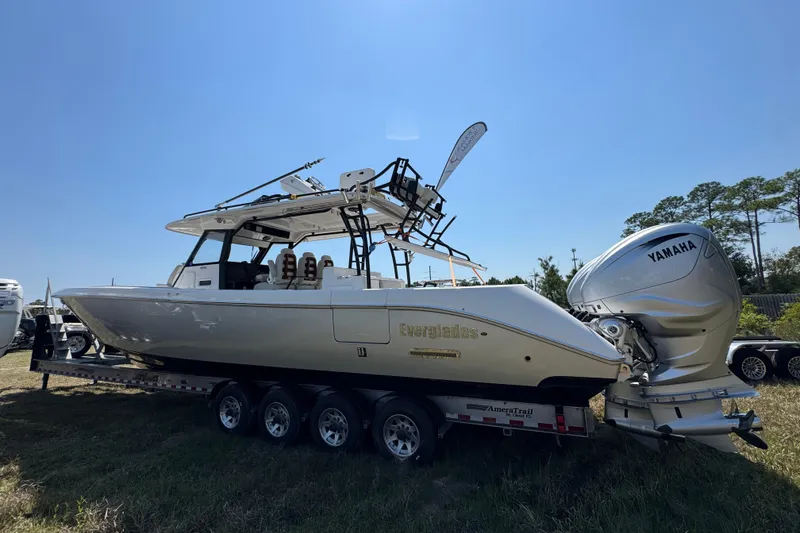 Slide: The Image of 2019 Everglades 435 Center Console boat on trailer with Yamaha engines, outdoors. - 6