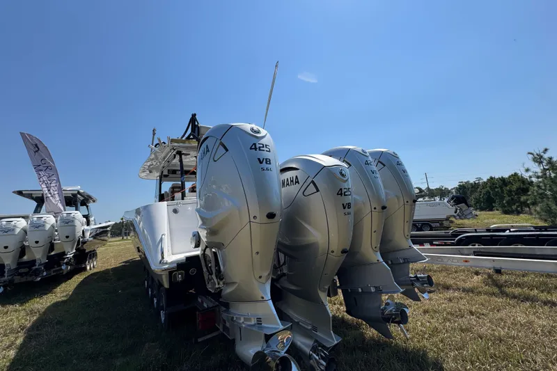Slide: The Image of 2019 Everglades 435 Center Console with triple Yamaha 425 V8 engines on display. - 9