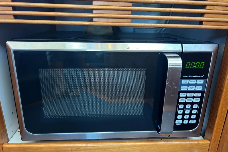 Slide: The Image of Hamilton Beach microwave in a 1996 Riviera 4800 Sport Yacht kitchen setup. - 12