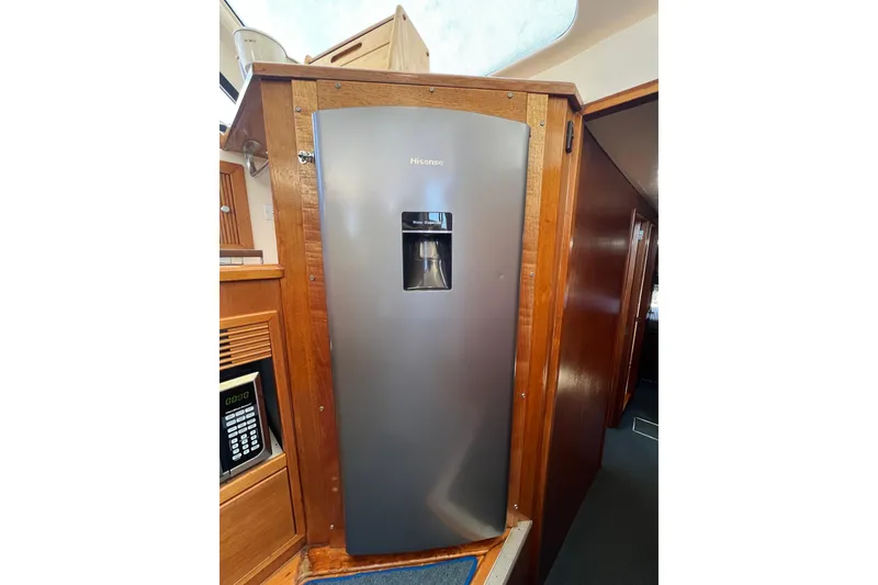 Slide: The Image of Stainless steel Hisense refrigerator in 1996 Riviera 4800 Sport Yacht interior. - 13