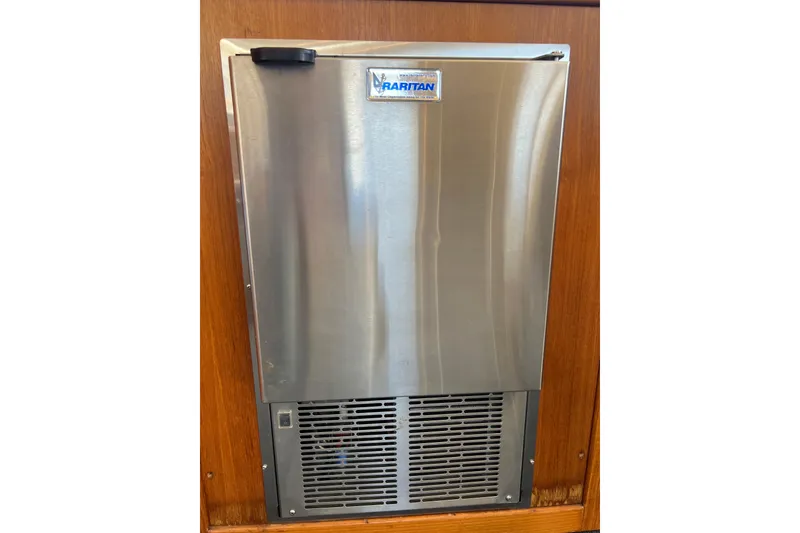 Slide: The Image of Stainless steel refrigerator on 1996 Riviera 4800 Sport Yacht, featuring a PBR logo. - 16