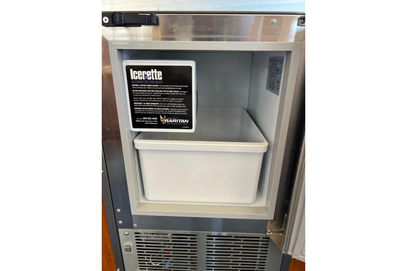 Slide: The Image of Ice maker inside 1996 Riviera 4800 Sport Yacht, featuring Raritan Icerette model. - 17