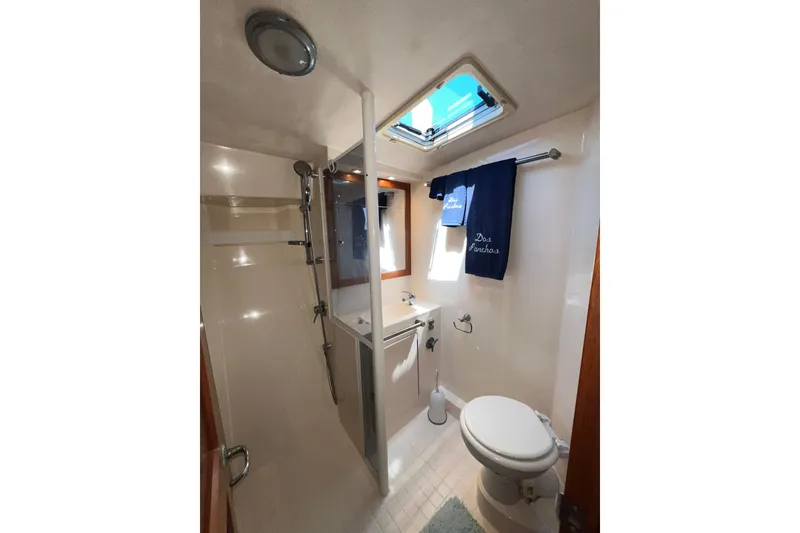 Slide: The Image of Bathroom interior of 1996 Riviera 4800 Sport Yacht with shower and skylight. - 20