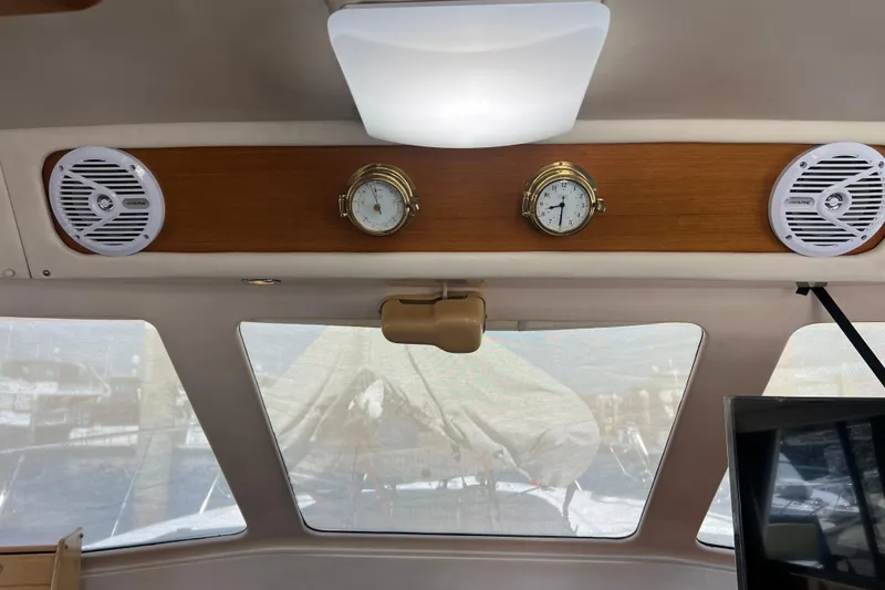 Slide: The Image of Interior of 1996 Riviera 4800 Sport Yacht with speakers and nautical instruments. - 25