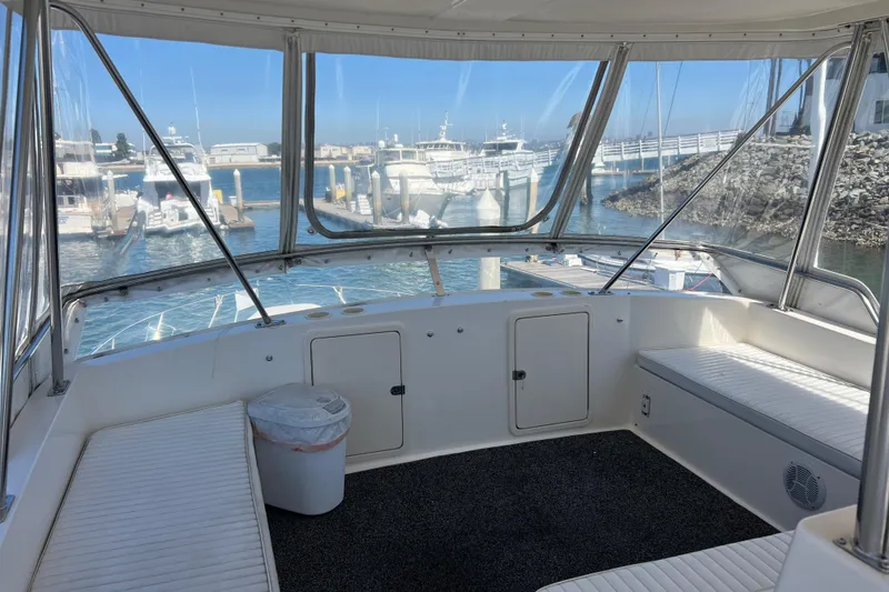 Slide: The Image of Interior view of 1996 Riviera 4800 Sport Yacht docked at marina. - 28