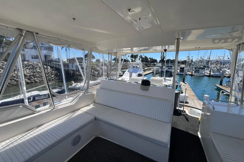 Slide: The Image of Interior view of 1996 Riviera 4800 Sport Yacht docked at marina. - 29