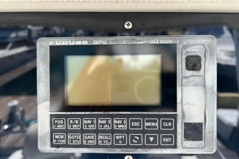 Slide: The Image of Furuno GPS Navigator GP-50 Mark-2 on 1996 Riviera 4800 Sport Yacht dashboard. - 38