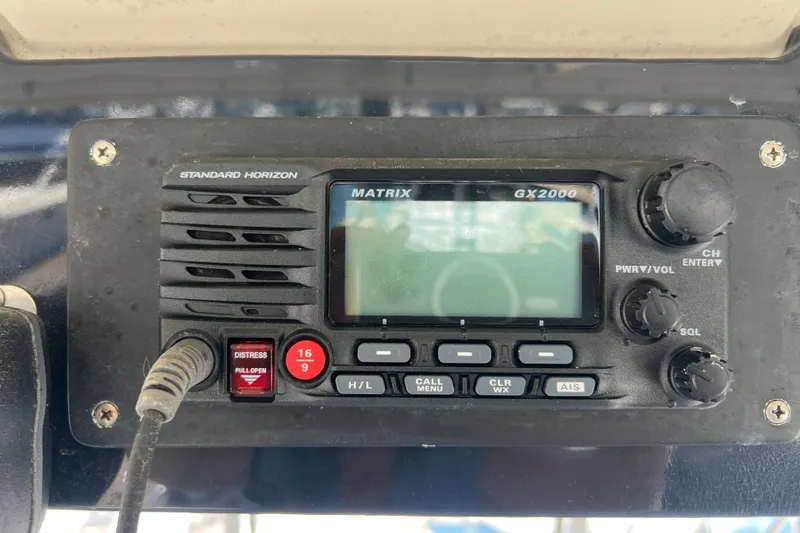 Slide: The Image of Standard Horizon Matrix GX2000 radio on 1996 Riviera 4800 Sport Yacht dashboard. - 42