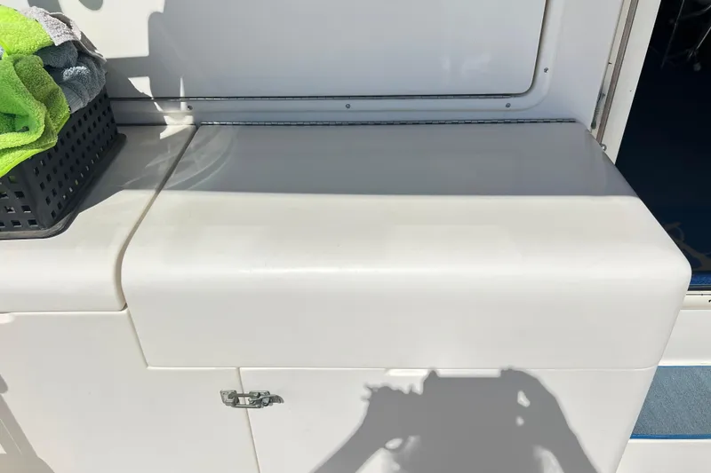 Slide: The Image of Riviera 4800 Sport Yacht 1996 interior detail with towels and storage compartment. - 45