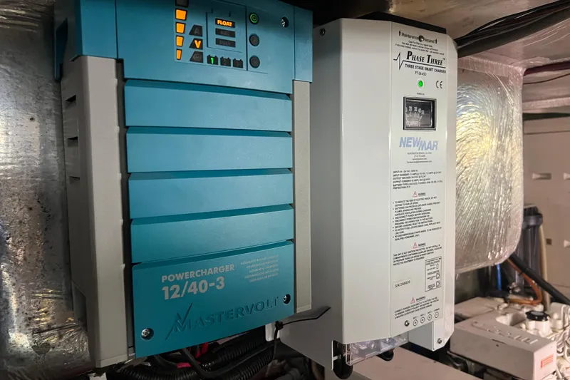 Slide: The Image of Mastervolt and Newmar chargers in a 1996 Riviera 4800 Sport Yacht engine room. - 58