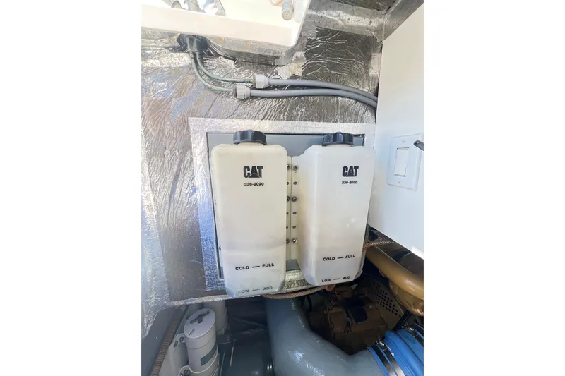 Slide: The Image of Engine compartment of a 1996 Riviera 4800 Sport Yacht with CAT coolant reservoirs. - 78