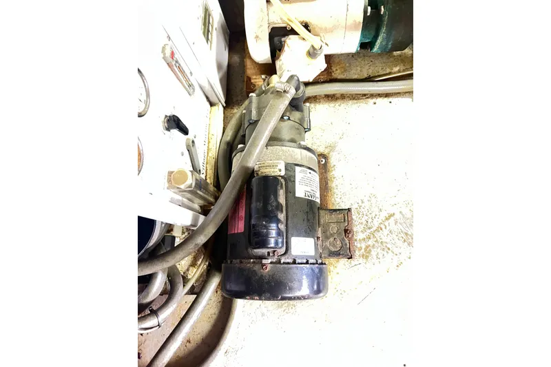 Slide: The Image of Engine room of 1996 Riviera 4800 Sport Yacht showing mechanical components and wiring. - 81