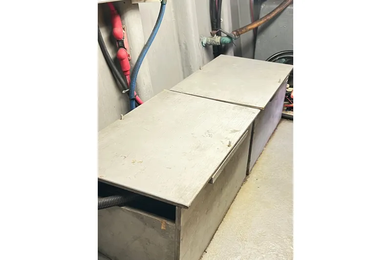 Slide: The Image of Engine compartment of a 1996 Riviera 4800 Sport Yacht with visible wiring and components. - 84