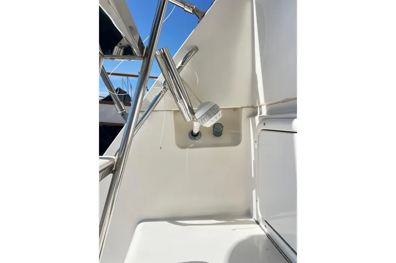 Slide: The Image of Close-up of 1996 Riviera 4800 Sport Yacht's deck with chrome fittings. - 89
