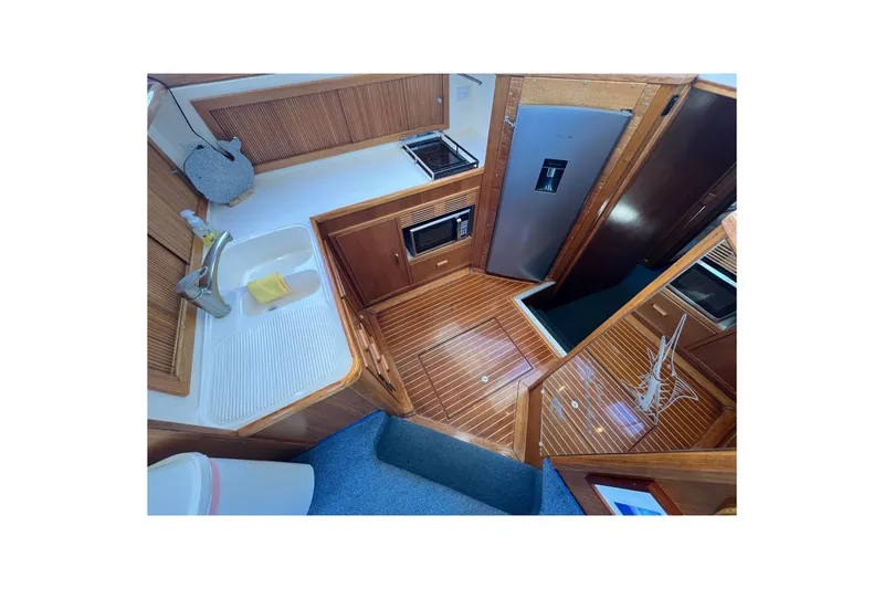 Slide: The Image of Interior of 1996 Riviera 4800 Sport Yacht with modern kitchen amenities. - 9