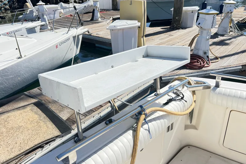 Slide: The Image of Riviera 4800 Sport Yacht 1996 at dock with fishing station and equipment. - 91