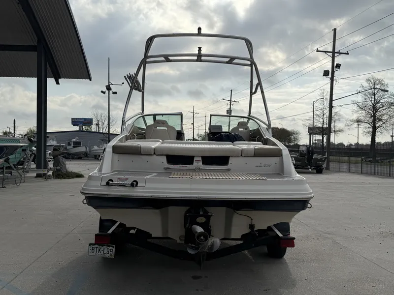 Slide: The Image of Rear view of a 2007 Sea Ray 210 boat on a trailer. - 12