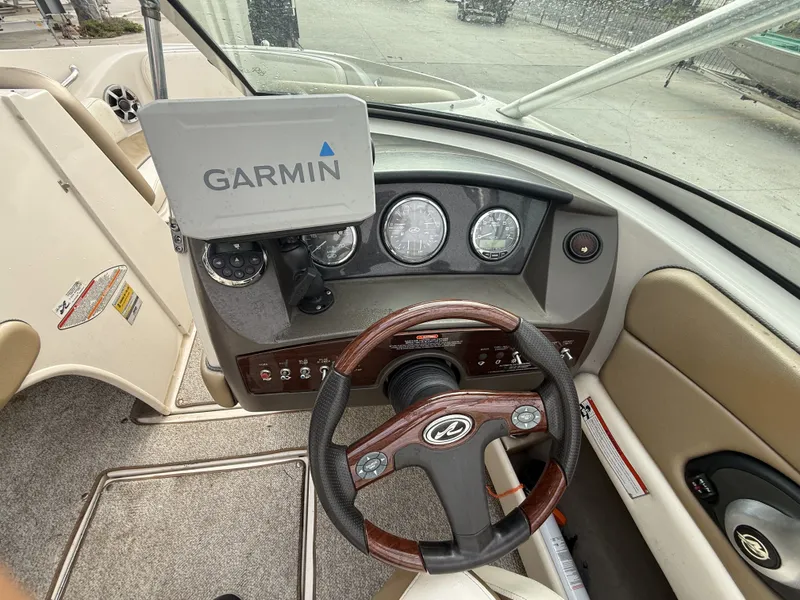 Slide: The Image of 2007 Sea Ray 210 boat helm with Garmin navigation system. - 15