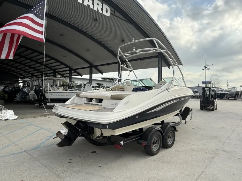 Slide: The Image of 2007 Sea Ray 210 boat on trailer under American flag. - 5