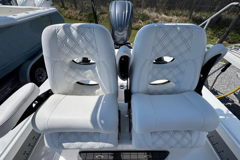 Slide: The Image of Luxury seating on 2025 BlackJack 256 Coastal boat, featuring white leather upholstery. - 22
