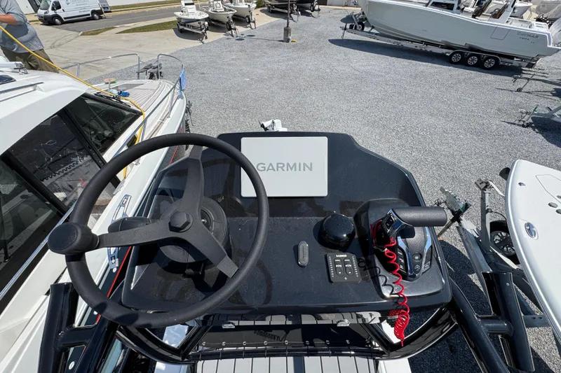 Slide: The Image of Steering console of 2025 BlackJack 256 Coastal boat with Garmin navigation system. - 40