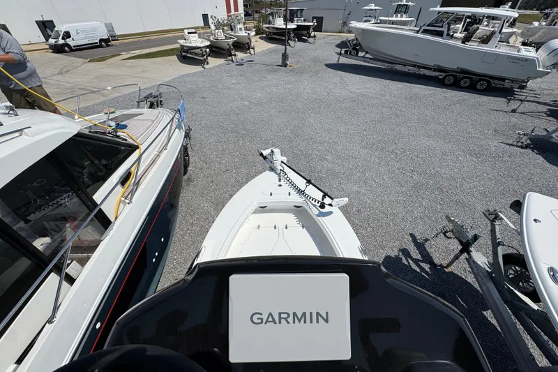 Slide: The Image of 2025 BlackJack 256 Coastal boat with Garmin equipment in a marina setting. - 41