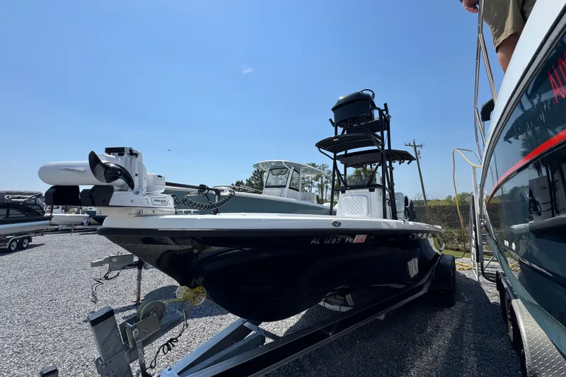 Slide: The Image of 2025 BlackJack 256 Coastal boat on trailer under clear blue sky. - 6