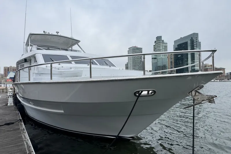 The Image of 1997 Tarrab 77 Motor Yacht docked in urban marina with city skyline backdrop. - 0