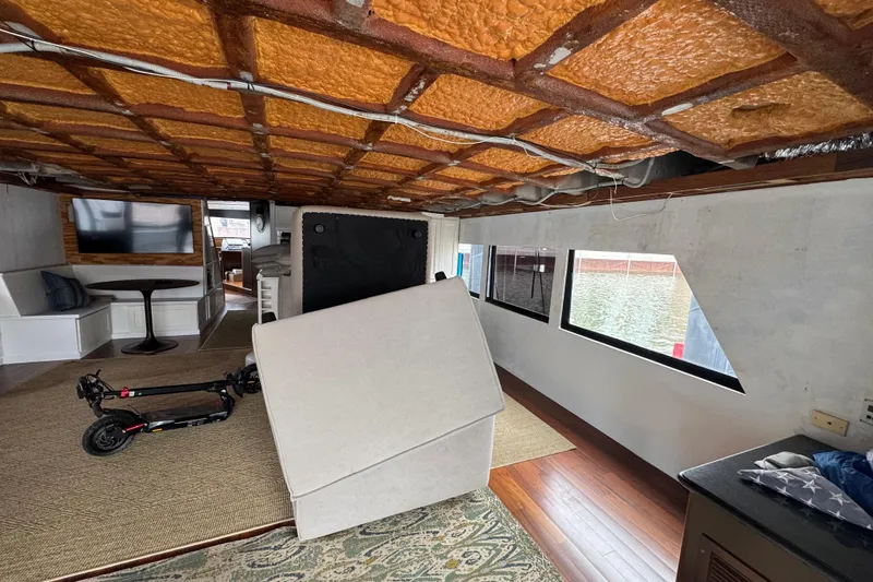 Slide: The Image of Luxurious interior of a 1997 Tarrab 77 Motor Yacht with modern furnishings and spacious layout. - 10