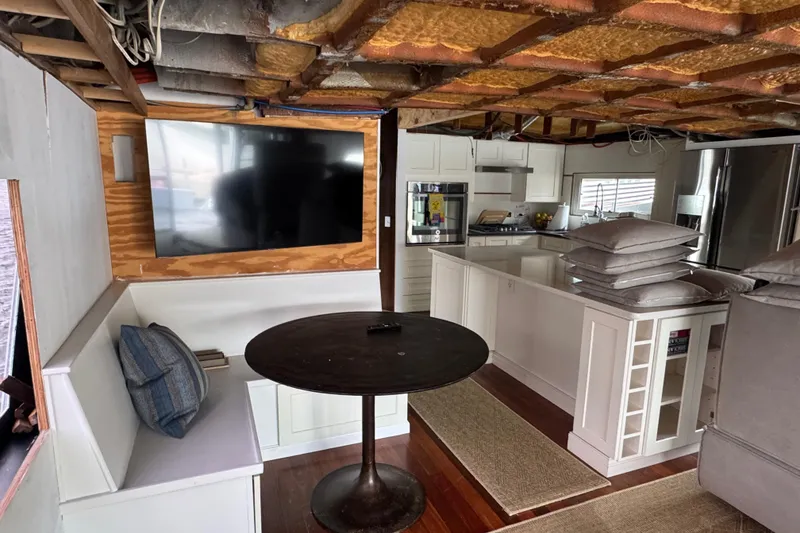 Slide: The Image of Interior of 1997 Tarrab 77 Motor Yacht with staircase and modern kitchen area. - 17